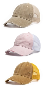 Detailed view of three distressed mesh trucker hats with washed cotton and torn accents