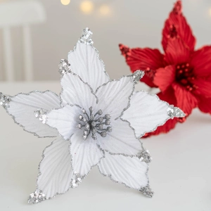 Poinsettia Christmas flower decoration with silver sequins and glitter on white background