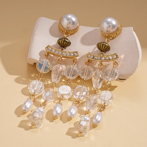 Detail of baroque pearl tassel earrings with crystal beads and gold alloy finish