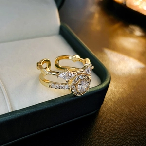 Macro shot of double-layer gold plated ring featuring triangle and round cubic zirconia