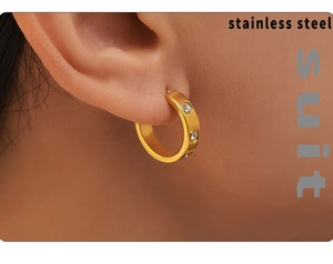 Close-up of 18K gold plated stainless steel C-shaped hoop earrings with clear zircons