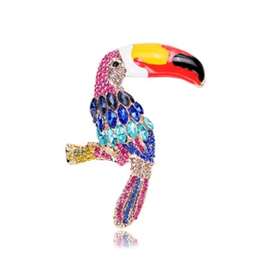 Detailed view of toucan brooch featuring colorful rhinestones and enamel details