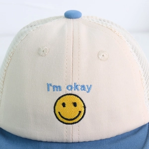 Breathable baby sun hat with embroidered smiley face and mesh back in blue and beige
