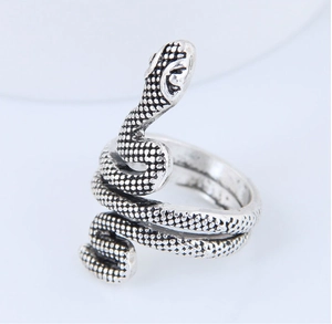 Close-up of vintage snake ring showing detailed diamond-shaped scale textures and antique silver finish