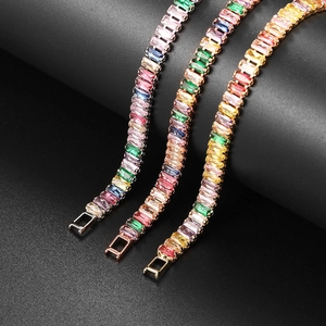 Detailed macro of silver, gold, and rose gold rainbow rectangle zircon tennis bracelets