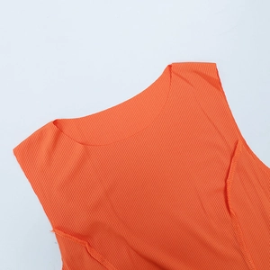 Close-up of vibrant orange ribbed knit fabric with crew neckline and stitching detail
