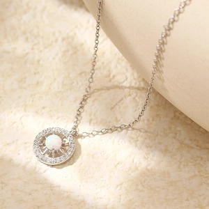Detail of s925 silver necklace with opal starburst compass pendant and small diamonds