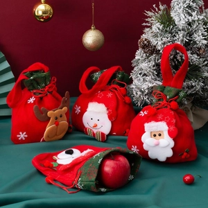 Detailed close-up of festive Christmas drawstring gift bags with 3D cartoon characters