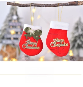 Close-up of mini felt Christmas socks and mittens with golden Merry Christmas ornaments