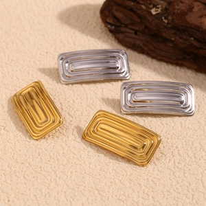 Minimalist rectangular gold and silver geometric stud earrings with ripple texture