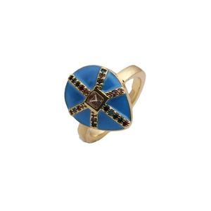 Detail of gold-plated copper ring with blue enamel and colorful micro-set zircons