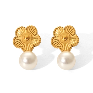 Detailed view of gold flower stud earrings with elegant white pearl drops