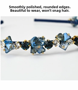 Macro detail of luxury blue crystal beads on a golden metal headband for women