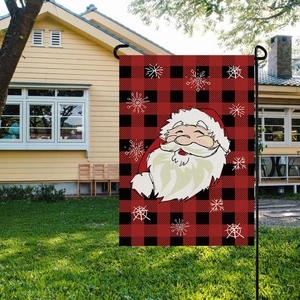 Christmas garden flag with red plaid pattern and Santa Claus hanging on a metal pole