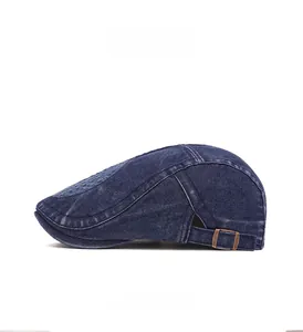 Detail view of denim ivy cap with vintage washed texture and bronze side adjustment buckle