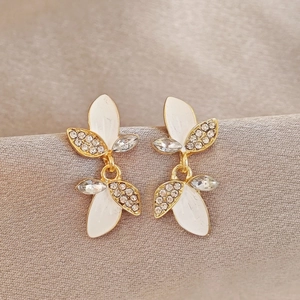 French style leaf stud earrings with white enamel and sparkling rhinestones in gold tone