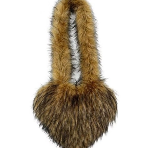 Brown heart-shaped faux fur crossbody bag with fluffy texture and long shoulder strap