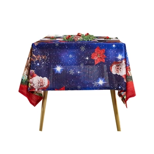 Dark blue Christmas tablecloth featuring Santa Claus and red poinsettia floral patterns