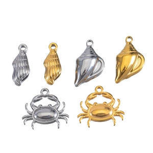 Selection of stainless steel crab and seashell charms in gold and silver finishes