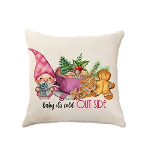 Pink Christmas linen pillow with gnome, gingerbread man and Baby It's Cold Outside text