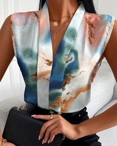 Close-up of women's V-neck sleeveless blouse featuring colorful abstract art print