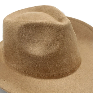 Detailed close-up of brown suede western cowboy hat featuring premium textured felt and stitching