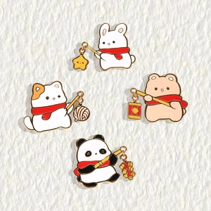 Cute cartoon animal enamel pins featuring a cat, rabbit, bear and panda with red scarves