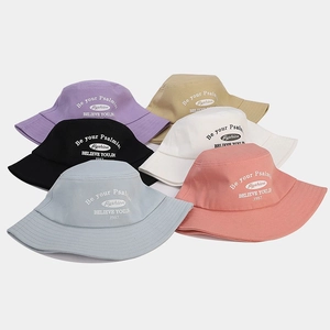 Set of six colorful cotton bucket hats with stylish embroidered lettering and sun protection