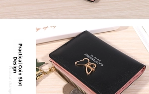 Detail view of small bifold wallet with gold butterfly buckle and tassel zipper pocket