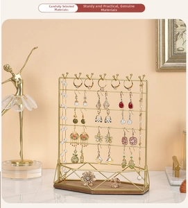 Five-tier gold metal jewelry stand with wooden tray for necklaces and rings display