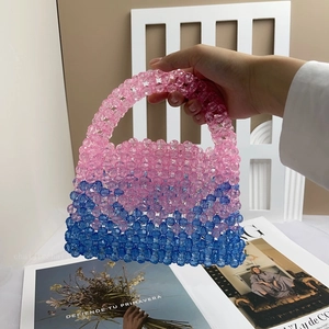 Detail of pink and blue gradient handmade beaded bag made from acrylic beads