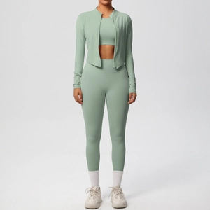 Detailed texture of sage green high-waisted leggings and zippered yoga jacket set