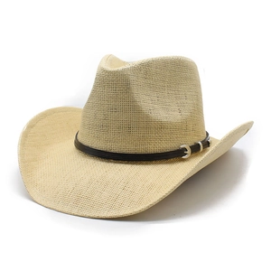 Straw jazz hat with leather belt buckle and curved brim in natural beige color