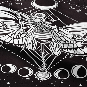 Close-up of bohemian butterfly tapestry fabric showing mystical moon phases and moth details