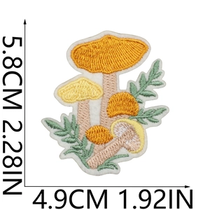 Detailed embroidery patch showing a yellow mushroom and green leaf with size dimensions