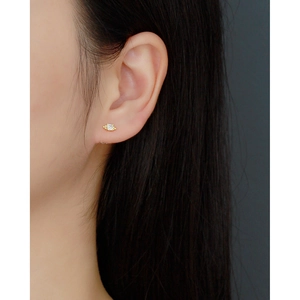 Minimalist S925 sterling silver gold stud earring with zircon on model's ear