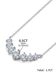 Detail view of seven 0.5CT moissanite stones on a 925 sterling silver smile necklace
