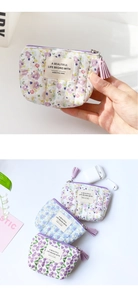 Close-up of floral cotton coin purses with tassels, showing compact size next to AirPods