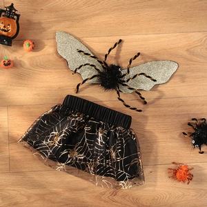 Detail of Halloween pet spider costume with golden glitter wings and tutu skirt