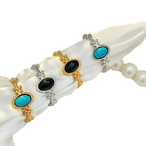 Vintage adjustable stainless steel rings set with turquoise and black oval gemstones