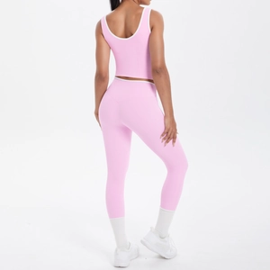 Back view of pink yoga set with high-waist leggings and cross-back sports bra set