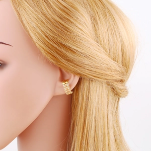 Elegant gold-tone ear cuff with multi-layered V-shaped rhinestone pavé design for women