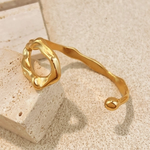 Fashionable twisted golden stainless steel open bangle with matte and polished finishes