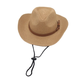 Detail of hand-woven raffia sun hat with leather band and adjustable chin strap
