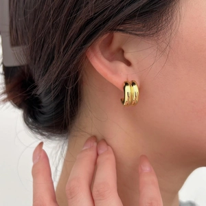 Minimalist double-row gold hoop earrings for women showing modern polished metallic texture