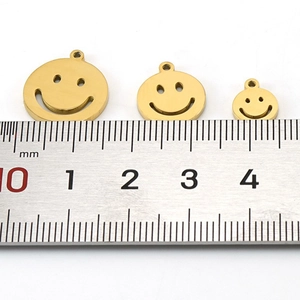 Detailed size comparison of three 18K gold smiley face pendants from 10mm to 17mm