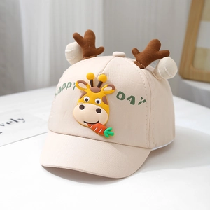 Detail of baby baseball cap with 3D giraffe decal and plush ears on beige fabric