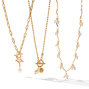 Elegant gold pearl necklaces featuring star pendants and toggle clasps on white background