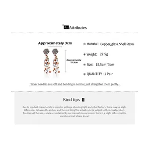 Detail view of long tassel earrings with dimensions showing shell and crystal elements