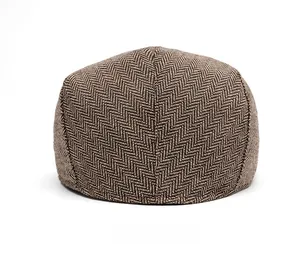 Rear view of a classic brown herringbone ivy cap showing fine texture and stitching